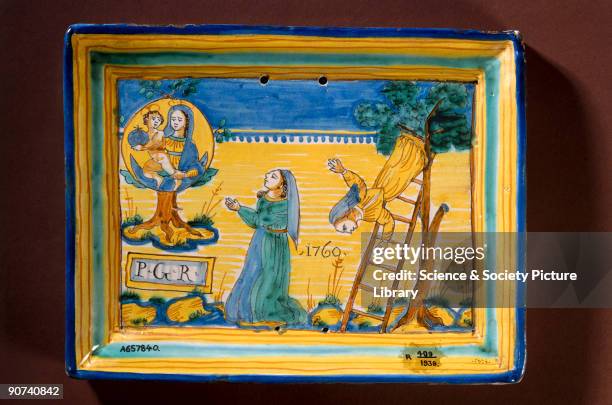 This glazed tin plaque was offered to the Virgin Mary as thanksgiving for salvation from dangerous situations. It shows a woman falling off a ladder....