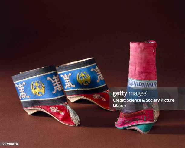 These shoes have a wooden sole with silk brocade uppers, decorated with applique and embroidery. Binding women's feet was a painful and crippling...