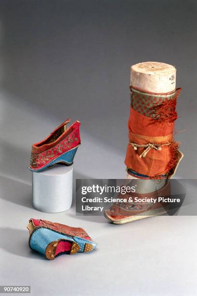 These slippers have a wooden sole with silk brocade uppers, decorated with applique and embroidery. Binding women's feet was a painful and crippling...