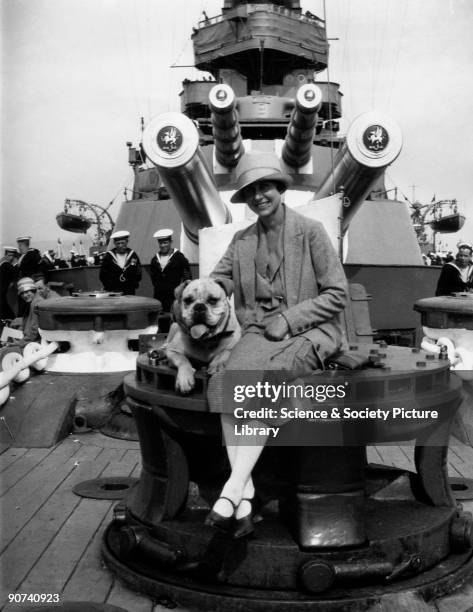 Officer's lady� on the fo�c�s�le capstan of a warship.