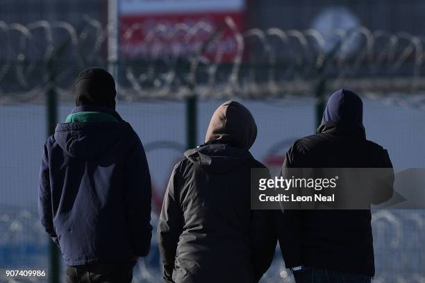 Group of young men gather near a truck depot on January 19, 2018 in Calais, France During a visit to the UK by French President Emmanual Macron, the...