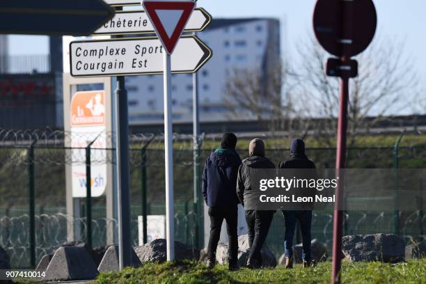 Group of young men gather near a truck depot on January 19, 2018 in Calais, France During a visit to the UK by French President Emmanual Macron, the...