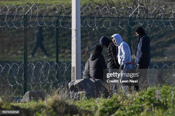 Group of young men gather near a truck depot on January 19, 2018 in Calais, France During a visit to the UK by French President Emmanual Macron, the...