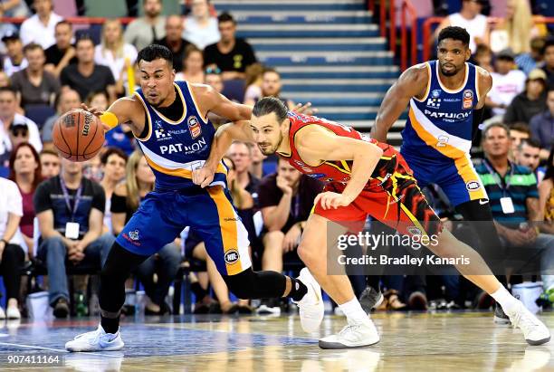 Stephen Holt of the Bullets steals the ball from Chris Goulding of United during the round 15 NBL match between the Brisbane Bullets and Melbourne...