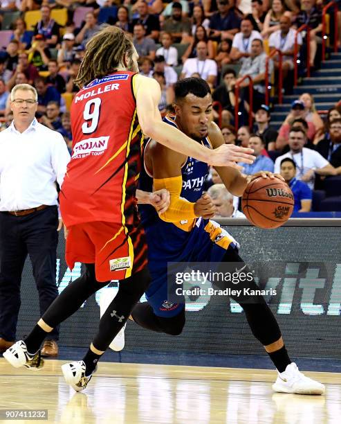 Stephen Holt of the Bullets takes on the defence of Craig Moller of United during the round 15 NBL match between the Brisbane Bullets and Melbourne...