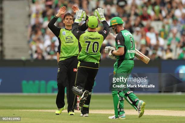 Chris Green of the Thunder celebrates taking the wicket of James Faulkner of the Stars during the Big Bash League match between the Melbourne Stars...