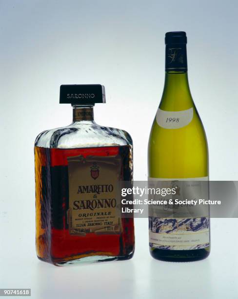 Bottle of French Pouilly Fume wine, and a bottle of Amaretto di Saronno, the Italian liqueur. Many ancient civilisations independently discovered...