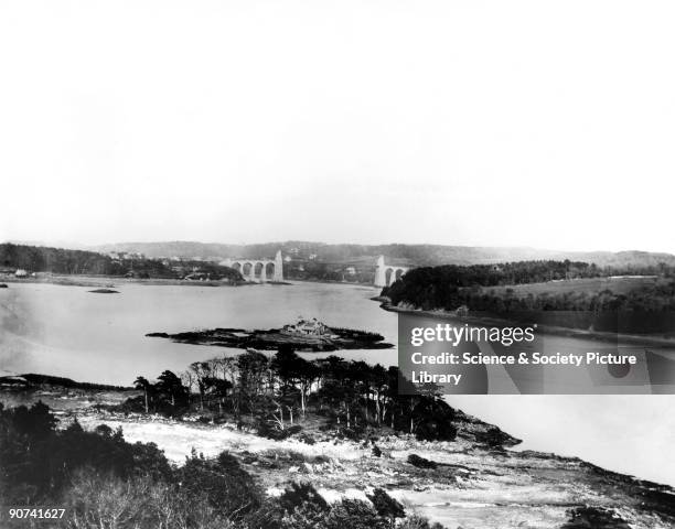 Thomas Telford's road suspension bridge as seen from Stephenson's Britannia Bridge. London & North Western Railway official photograph.