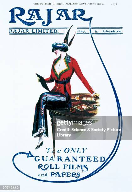 Fashionable woman perches on the edge of a table, admiring Rajar�s photographic products. Rajar Limited of Mobberley in Cheshire was established in...