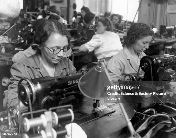 Shoe manufacture, 1950. Women stitching shoes with Singer sewing machines at Messrs Roberts factory in Leicester. Scene from the British Transport...