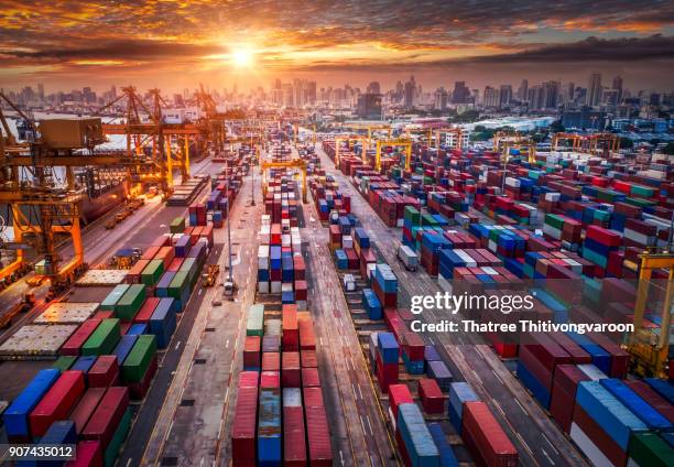 container ship in import export and business logistic, by crane, trade port, shipping cargo to harbor, aerial view from drone, international transportation, business logistics concept - güterzug stock-fotos und bilder