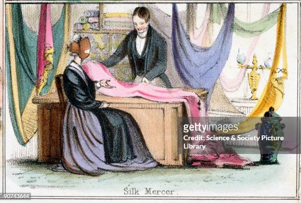 Vignette from a lithographic plate showing a silk mercer showing a selection of silk to a client. Taken from �The Silk-Worm� in 'Graphic...