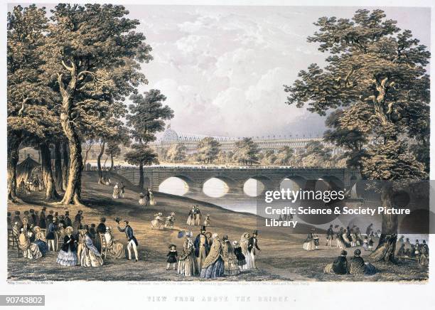 Lithograph by Day & Son after an original painting by Phillip Brannan, showing crowds near a bridge over the Serpentine in Hyde Park, with the...
