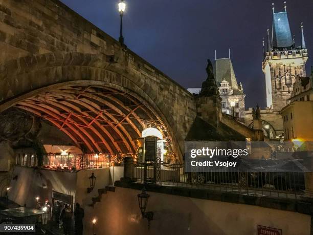 restaurant under charles bridge, prague, czech republic - charles bridge stock-fotos und bilder