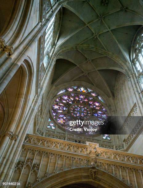 the south door's interior - coloured stained-glass windows and the church ceiling, st. vitus cathedral, prague castle, czech republic - stained glass czech republic stock pictures, royalty-free photos & images