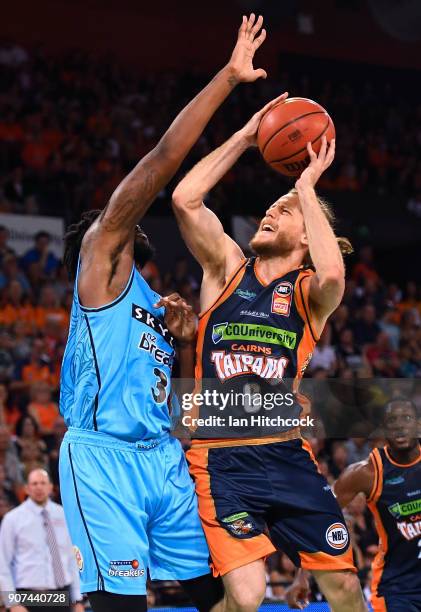 Damon Heir of the Taipans takes a shot over Rakeem Christmas of the Breakers during the round 15 NBL match between the Cairns Taipans and the New...