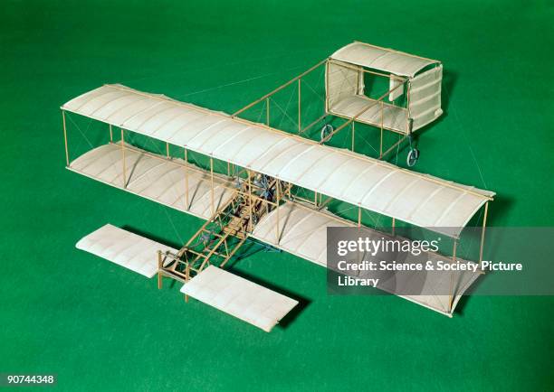 Model . By 1908 the Voisin biplane was standardised in the form seen in this model. It has a forward elevator, biplane wings and a box-kite tail-unit...