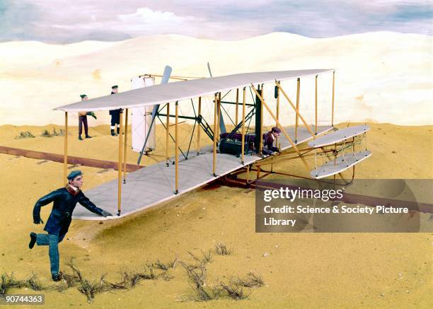 Diorama featuring a model of the aircraft in which Orville Wright and Wilbur Wright made the world's first controlled and powered flights on 17th...
