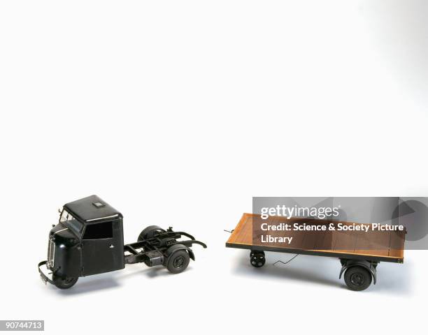 Model . The tractor is shown with a four-ton trailer. This type of vehicle was built to transport goods over short distances. The engine, which is...