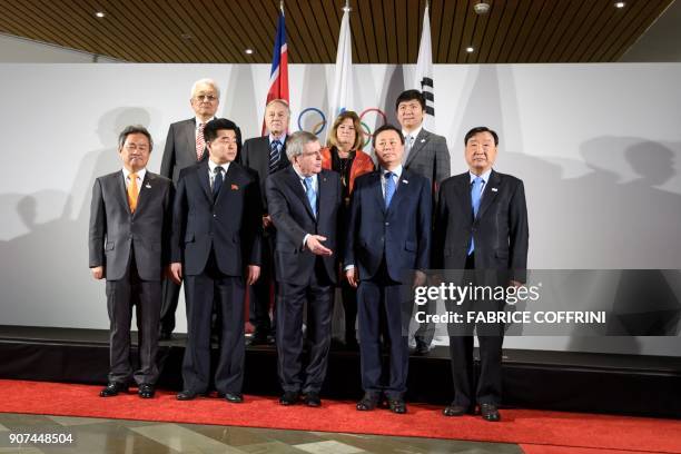 South Korea's National Olympic Committee President Lee Kee-heung, North Korea's Olympic Committee President and Sports Minister Kim Il Guk, German...