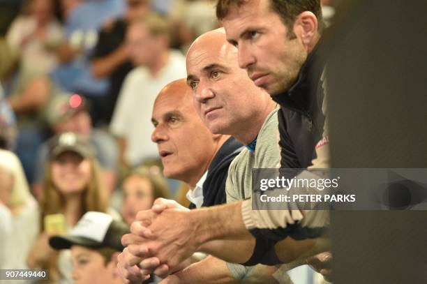 Coaches Radek Stepanek and Andre Agassi watch Serbia's Novak Djokovic play Spain's Albert Ramos-Vinolas in their men's singles third round match on...