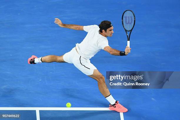 Roger Federer of Switzerland plays a backhand in his third round match against Richard Gasquet of France on day six of the 2018 Australian Open at...