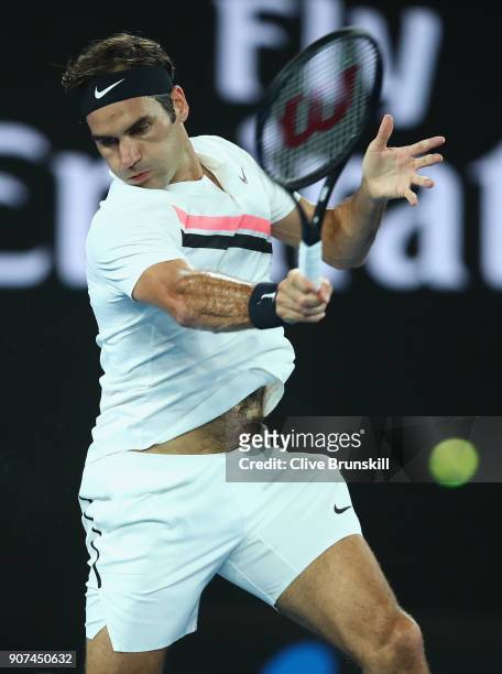Roger Federer of Switzerland plays a forehand in his third round match against Richard Gasquet of France on day six of the 2018 Australian Open at...