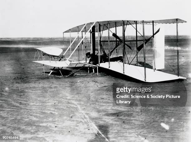 Wilbur Wright at the controls of the 'Flyer' at Kitty Hawk, North Carolina, United States. Orville Wright and his brother Wilbur were self-taught...