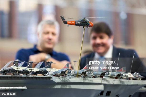 Dave Fortey and Stephen Metcalfe MP, the new 2018 Government Envoy for the Year of Engineering look at details on Mr Fortey's model of HMS Ark Royal...