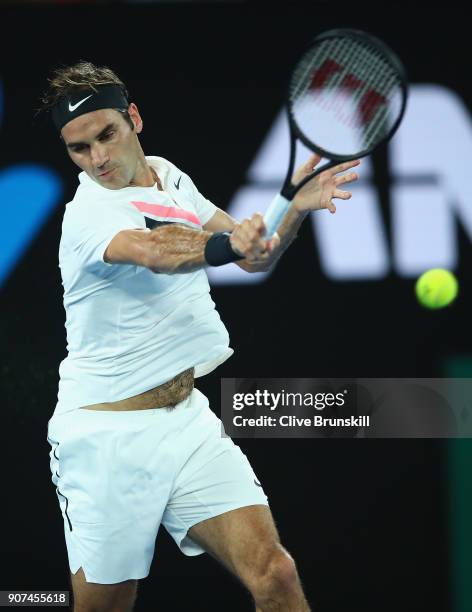 Roger Federer of Switzerland plays a forehand in his third round match against Richard Gasquet of France on day six of the 2018 Australian Open at...