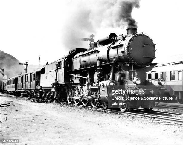 Steam locomotive, 1929. Hungarian Railways 424 Class 4-8-0 steam locomotive No 424.010 leaving Budapest East Station with the Simplon Orient Express...