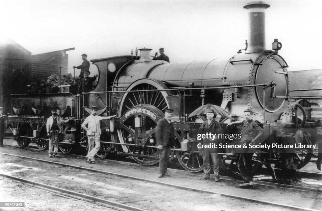�Iron Duke steam locomotive with railway workers, c 1880s.