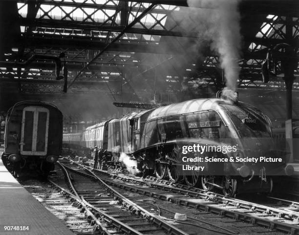 The Commonwealth of Australia A4 Class steam locomotive No 60012 backing on to an express train at Newcastle Station, Tyne & Wear. Photograph by...