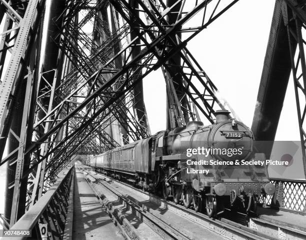 British Railways' Standard Class 5 steam locomotive crossing the Forth Bridge with a local train heading for Edinburgh, c 1958. Photograph by Bishop...