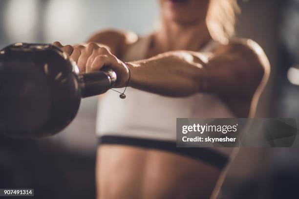 close up of unrecognizable athlete exercising with kettle bell. - kettlebell imagens e fotografias de stock