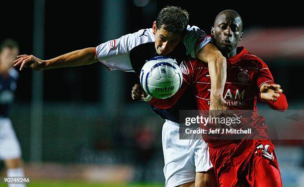 Jackie McNamara of Falkirk tackles Sone Aluko of Aberdeen during the Clydesdale Bank Scottish Premier league match between Falkirk and Aberdeen at...