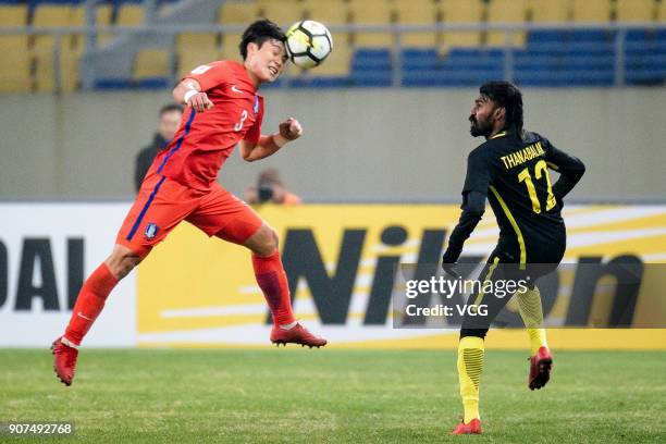 Lee Gun of South Korea heads the ball during the AFC U-23 Championship quarter-final match between South Korea and Malaysia at Kushan Sports Center...