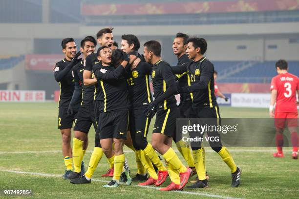 Players of Malaysia celebrate a point during the AFC U-23 Championship quarter-final match between South Korea and Malaysia at Kushan Sports Center...