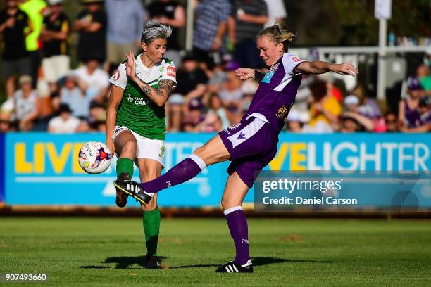 Kim Carroll of Perth Glory kicks past Michelle Heyman of Canberra United during the round 12 W-League match between the Perth Glory and Canberra...