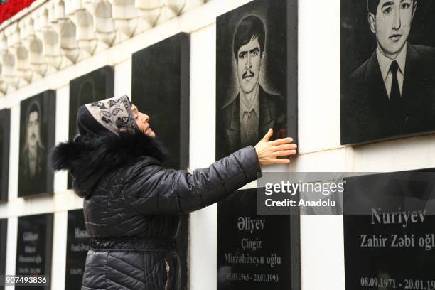 An Azerbaijani visits the Alley of Martyrs, a cemetery and memorial dedicated to those killed by Soviet troops during the 1990 Black January...