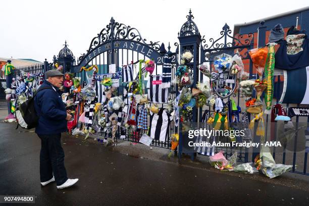 Floral tributes along with shirts and scarves left by West Bromwich Albion Fans in memory of Cyrille Regis on the Jeff Astle gates at The Hawthorns...