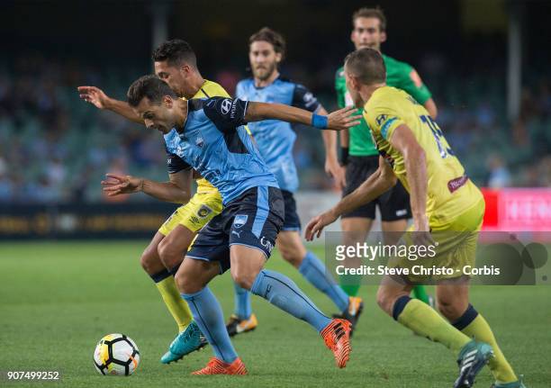 Bobo of Sydney FC is battles for the ball by Mariners defence during the round 17 A-League match between Sydney FC and the Central Coast Mariners at...