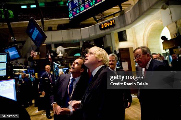 Boris Johnson the mayor of London, speaks with Robert Hardy , a trader on the floor of the New York Stock Exchange prior to ringing the closing bell...