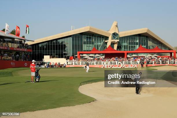 Thomas Pieters of Belgium plays his third shot from a bunker on the 18th hole during round three of the Abu Dhabi HSBC Golf Championship at Abu Dhabi...