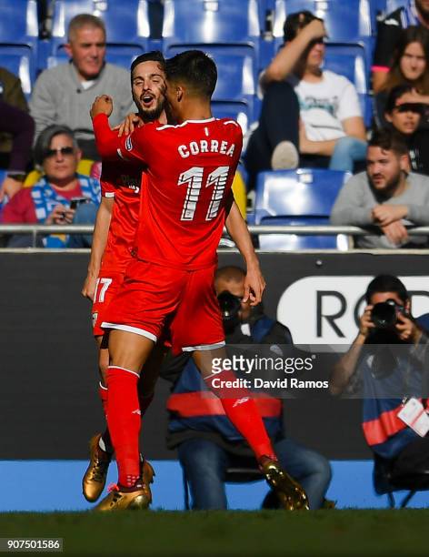 Pablo Sarabia of Sevilla FC celebrates with his team mate Joaquin Correa after scoring his team's second goal during the La Liga match between...