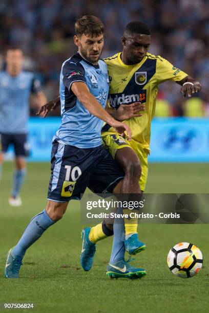 Milos Ninkovic of Sydney FC battles for the ball with Mariners Kwabena Appiah-Kubi during the round 17 A-League match between Sydney FC and the...