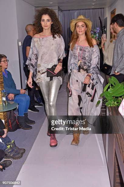 Models walk the runway during KIK/ANN fashion show on the smallest catwalk of the world at Art'Otel Mitte on January 19, 2018 in Berlin, Germany.