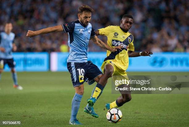 Milos Ninkovic of Sydney FC battles for the ball with Mariners Kwabena Appiah-Kubi during the round 17 A-League match between Sydney FC and the...