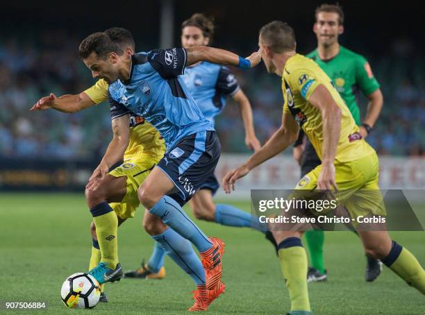 Bobo of Sydney FC is battles for the ball by Mariners defence during the round 17 A-League match between Sydney FC and the Central Coast Mariners at...