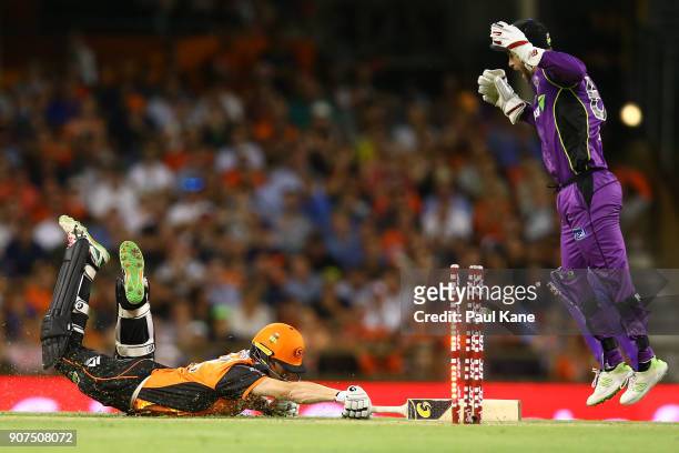 Matthew Wade of the Hurricanes celebrates the direct hit by Jofra Archer to run out Adam Voges of the Scorchers during the Big Bash League match...